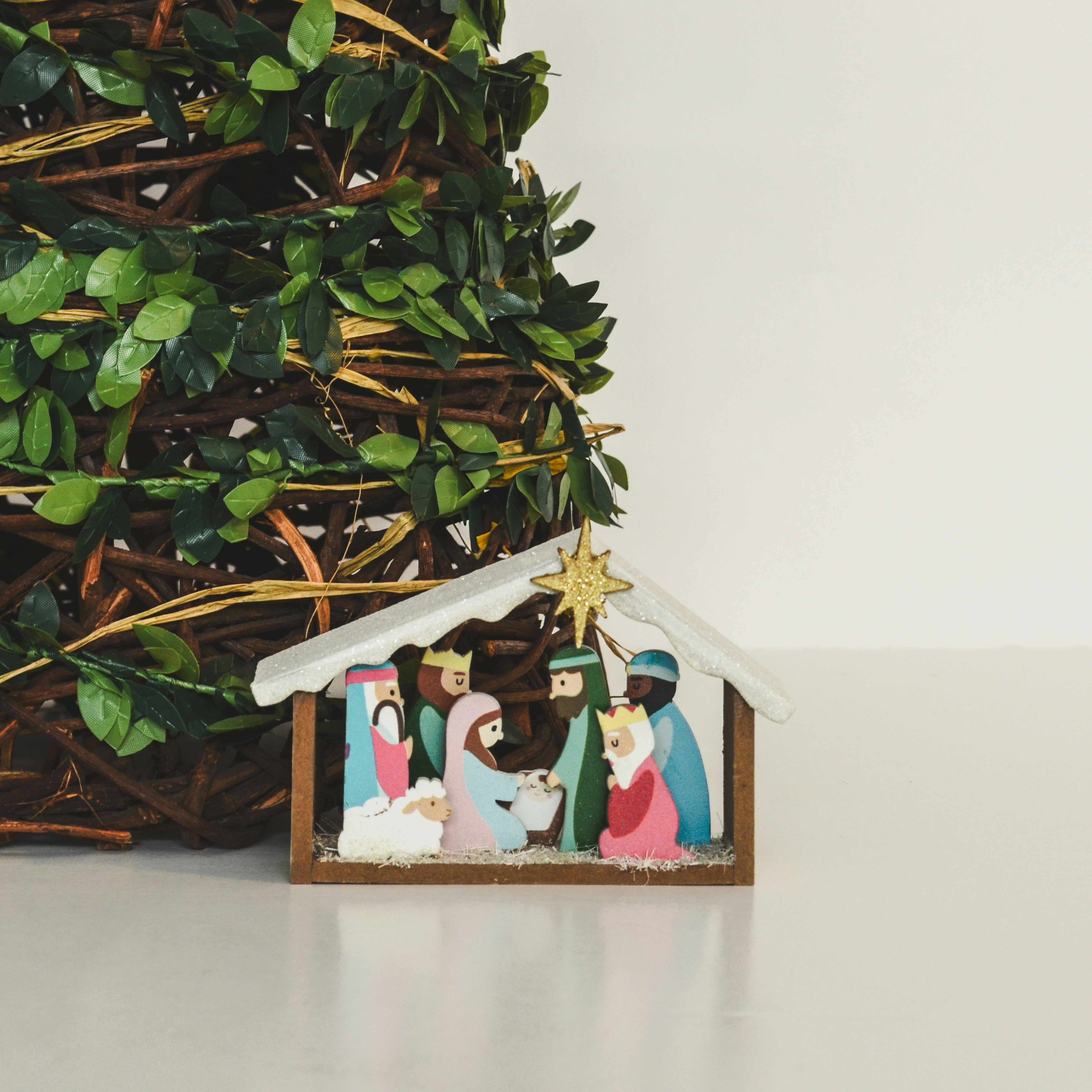 A nativity scene with a christmas tree and a nativity scene