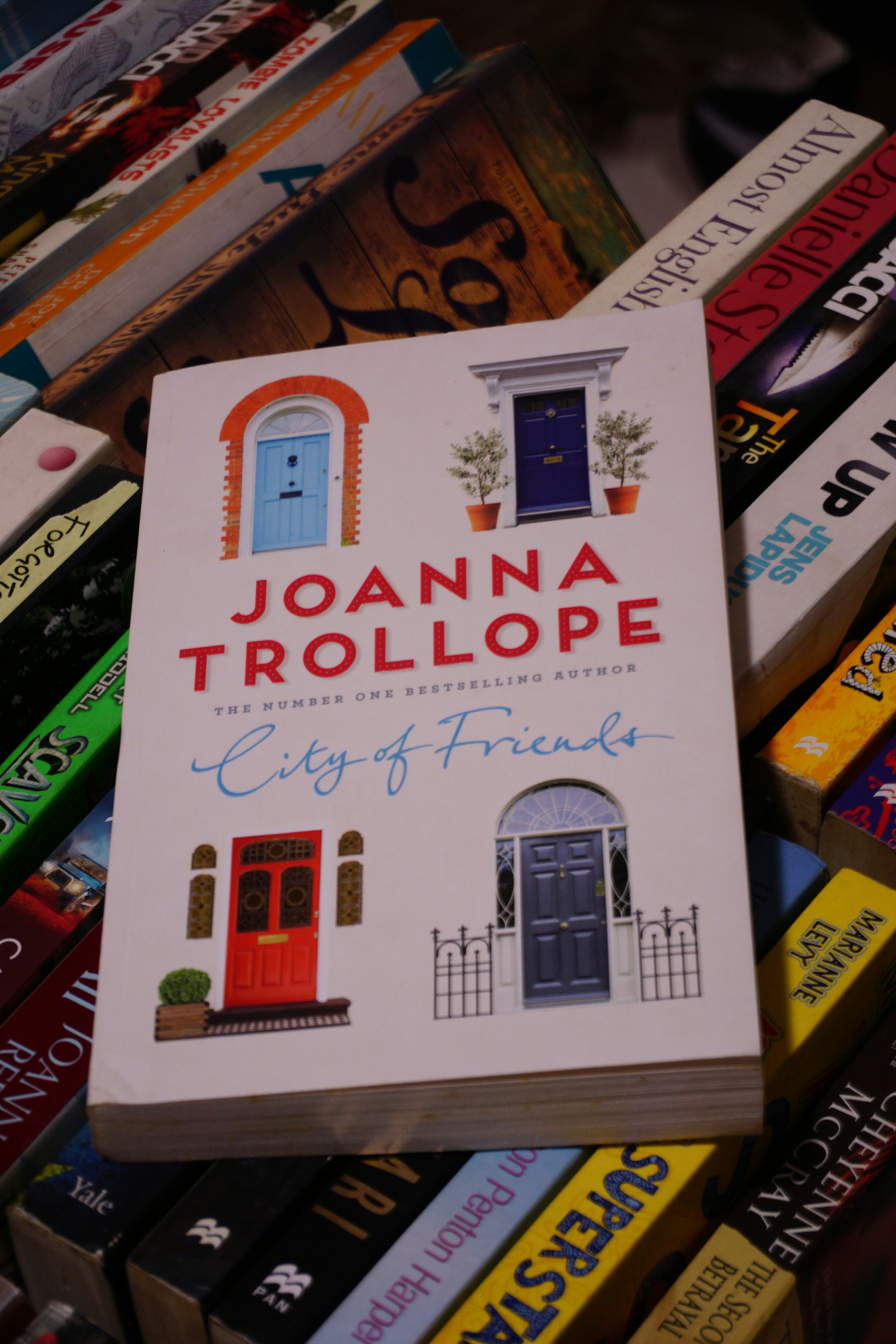 A book sitting on top of a pile of books