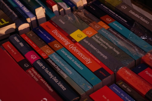 A pile of books sitting on top of a table