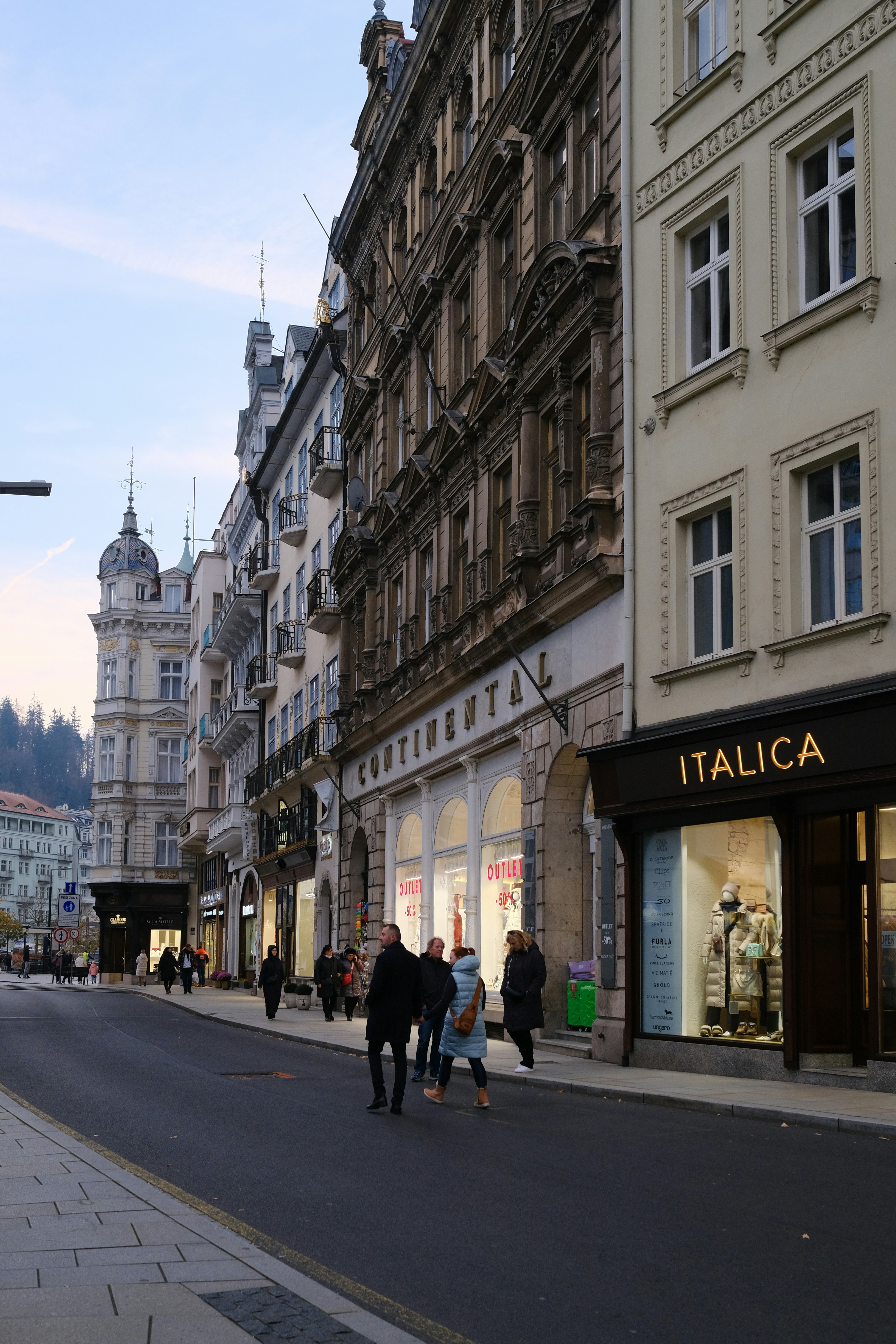 People walking down a street in a european city