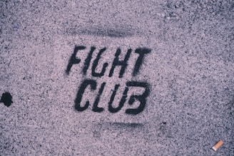 The word fight club is written on the sidewalk