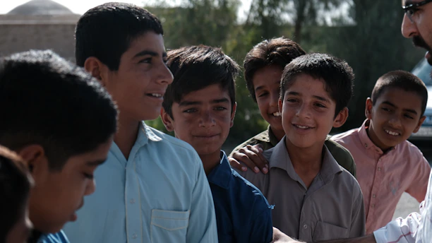 A group of young men standing next to each other