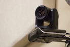 A camera attached to the side of a wall