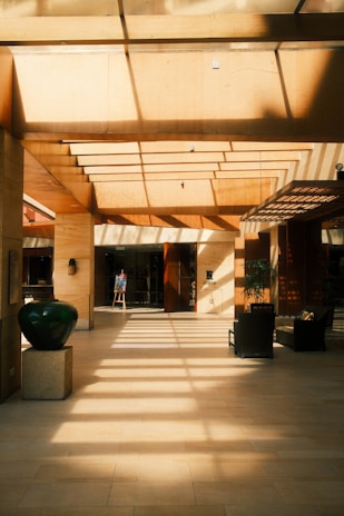 A large room with a lot of light coming in from the ceiling