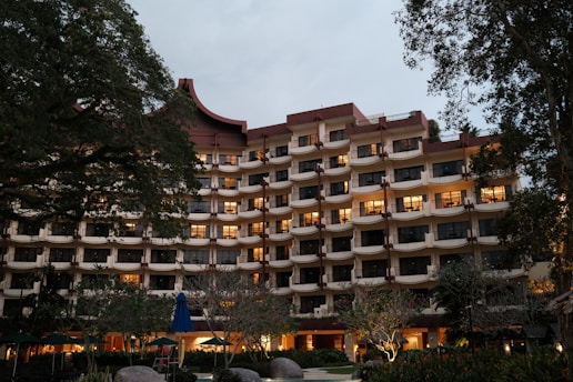 A large building with many windows lit up at night