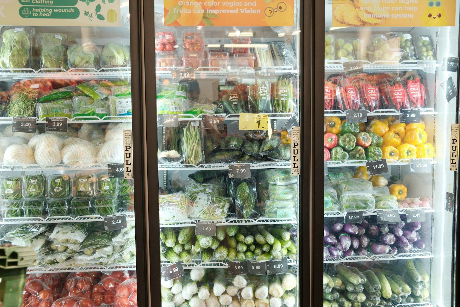 A refrigerator filled with lots of vegetables and fruits