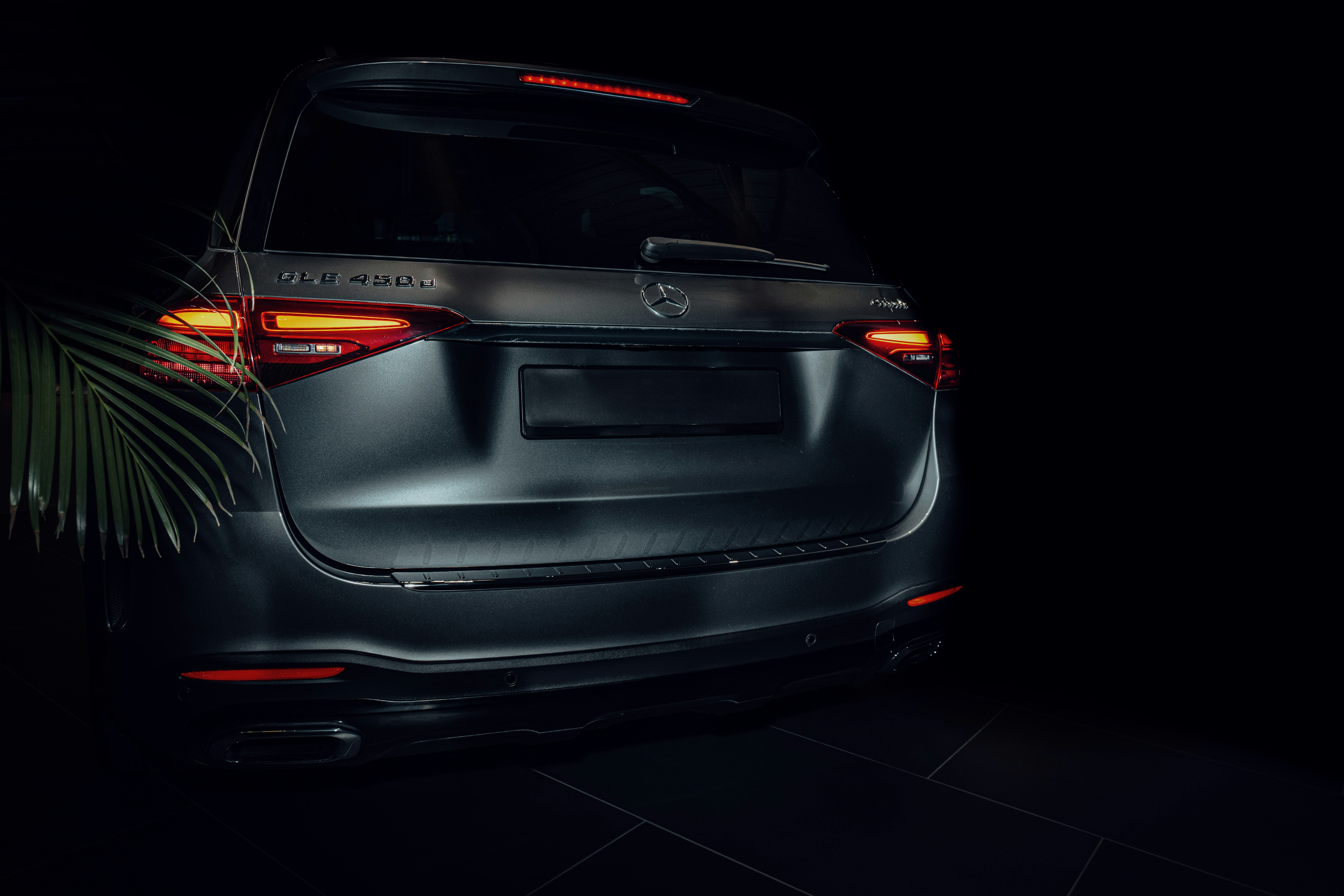 The back end of a car in a dark room