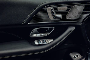 A close up of a steering wheel and dashboard of a car