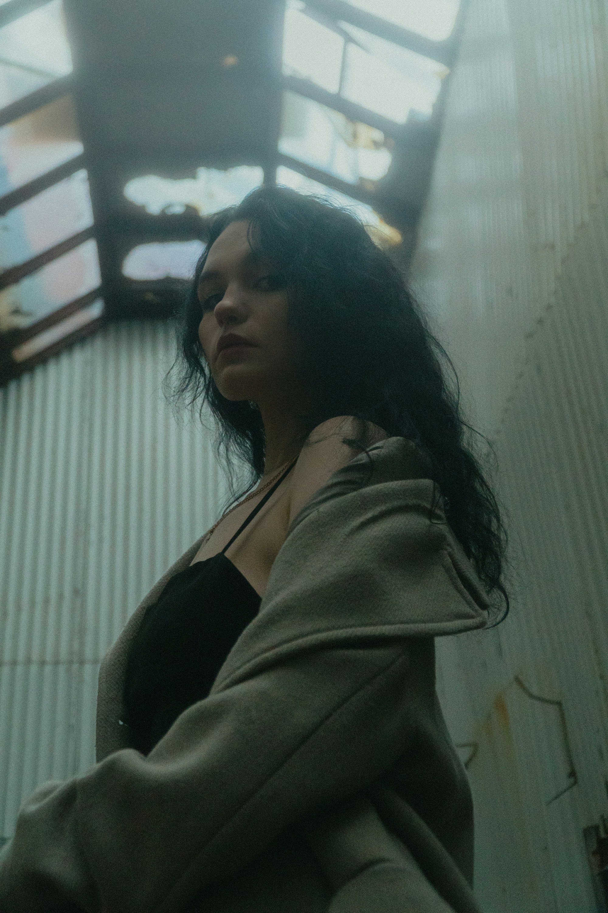 A woman standing in front of a building