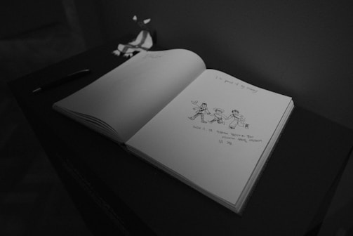 A black and white photo of an open book