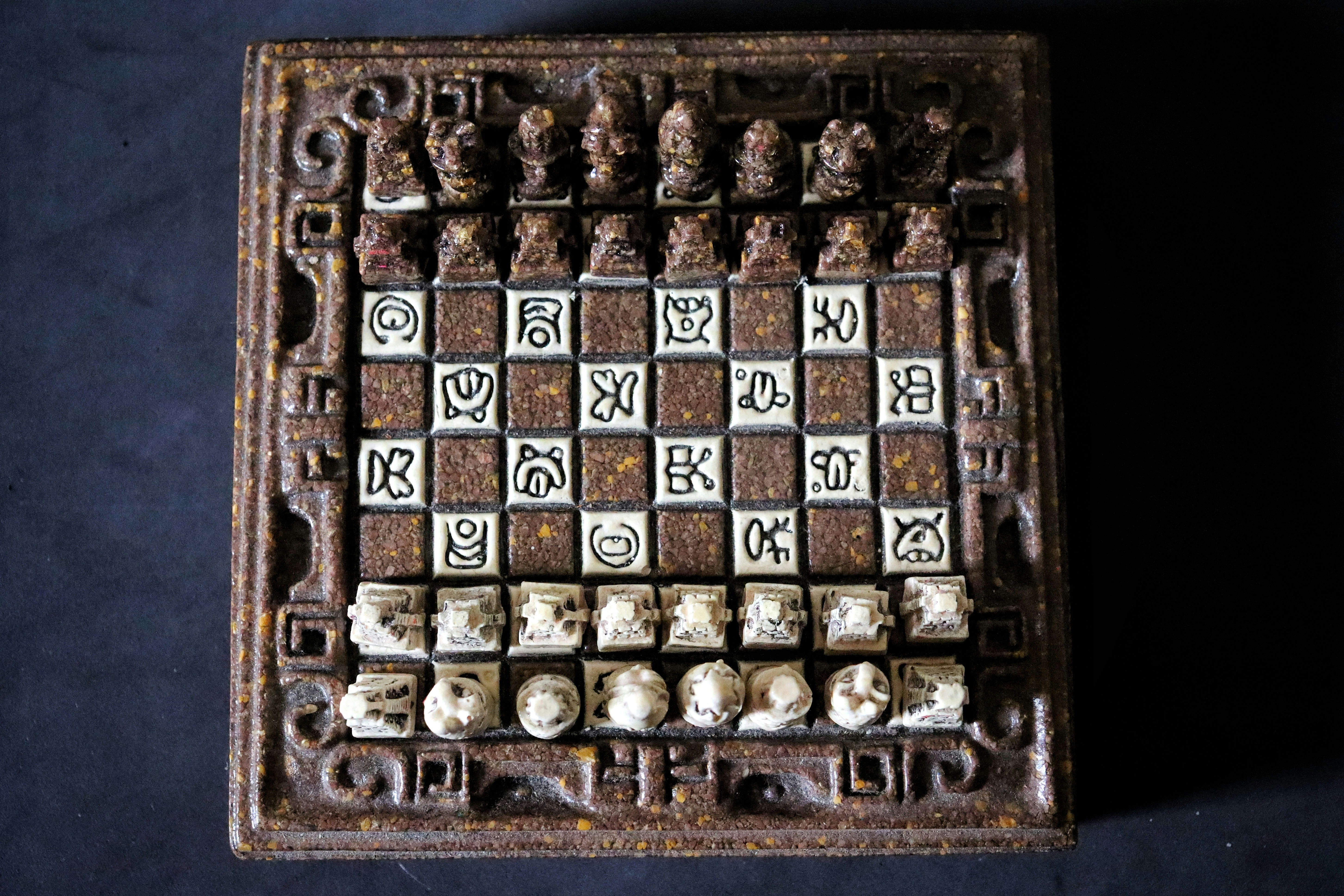 Wooden chess board with chess pieces