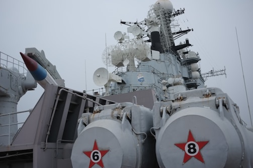 A large battleship with two red stars on it