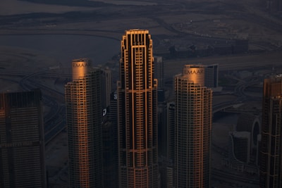 A view of a city at night from the top of a skyscraper