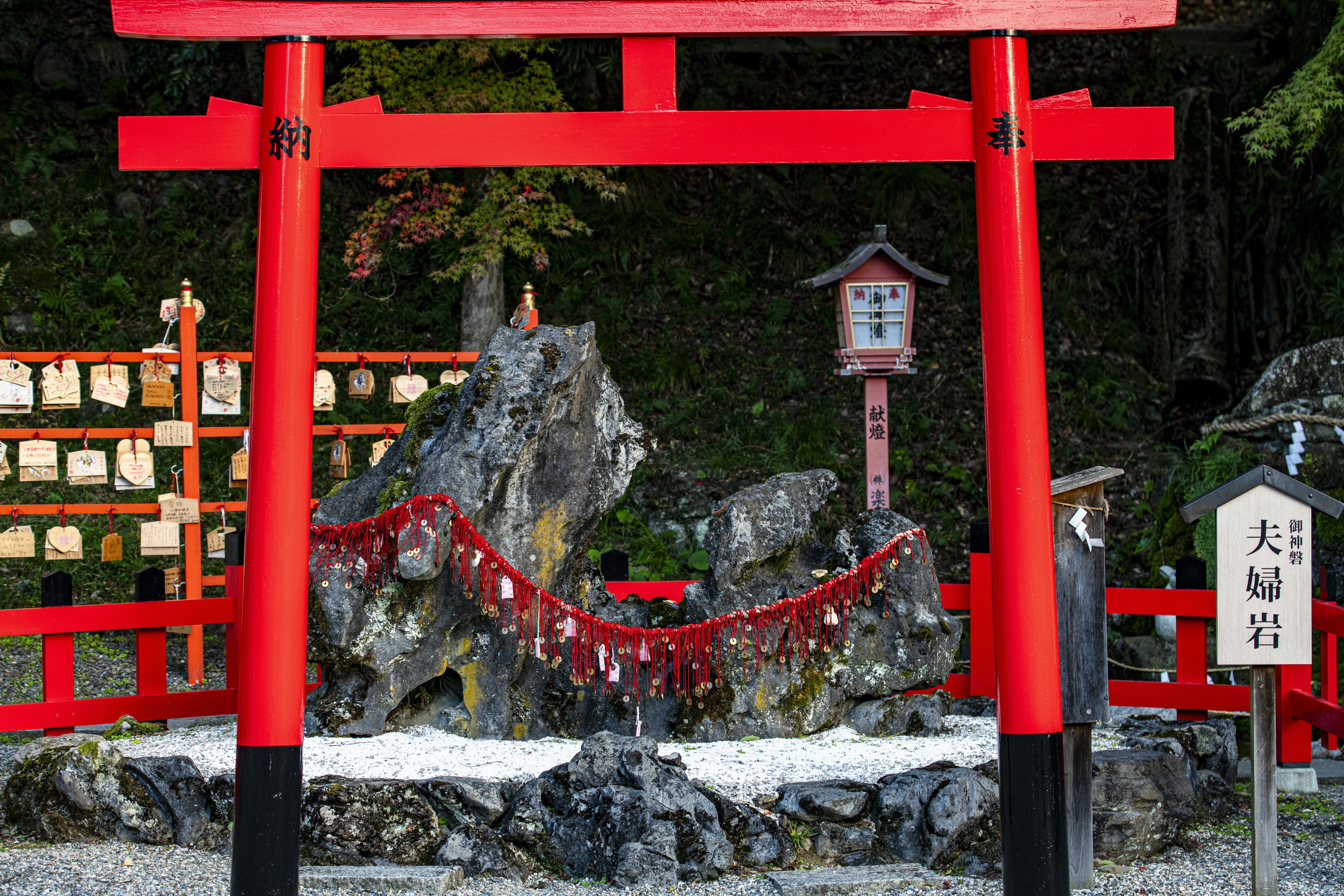 Red torii gate entrance to a Japanese shrine