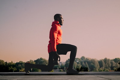 A man riding a skateboard on top of cement