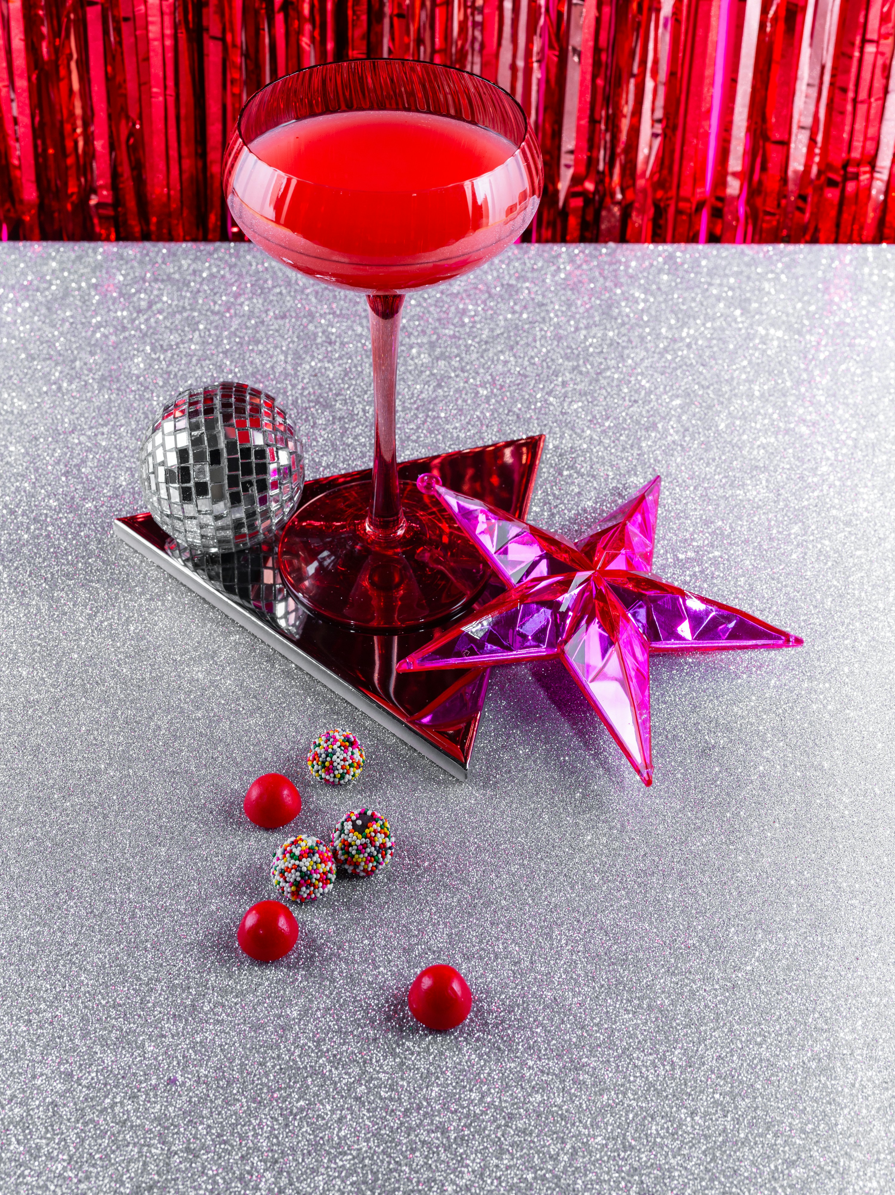 A red drink sitting on top of a table