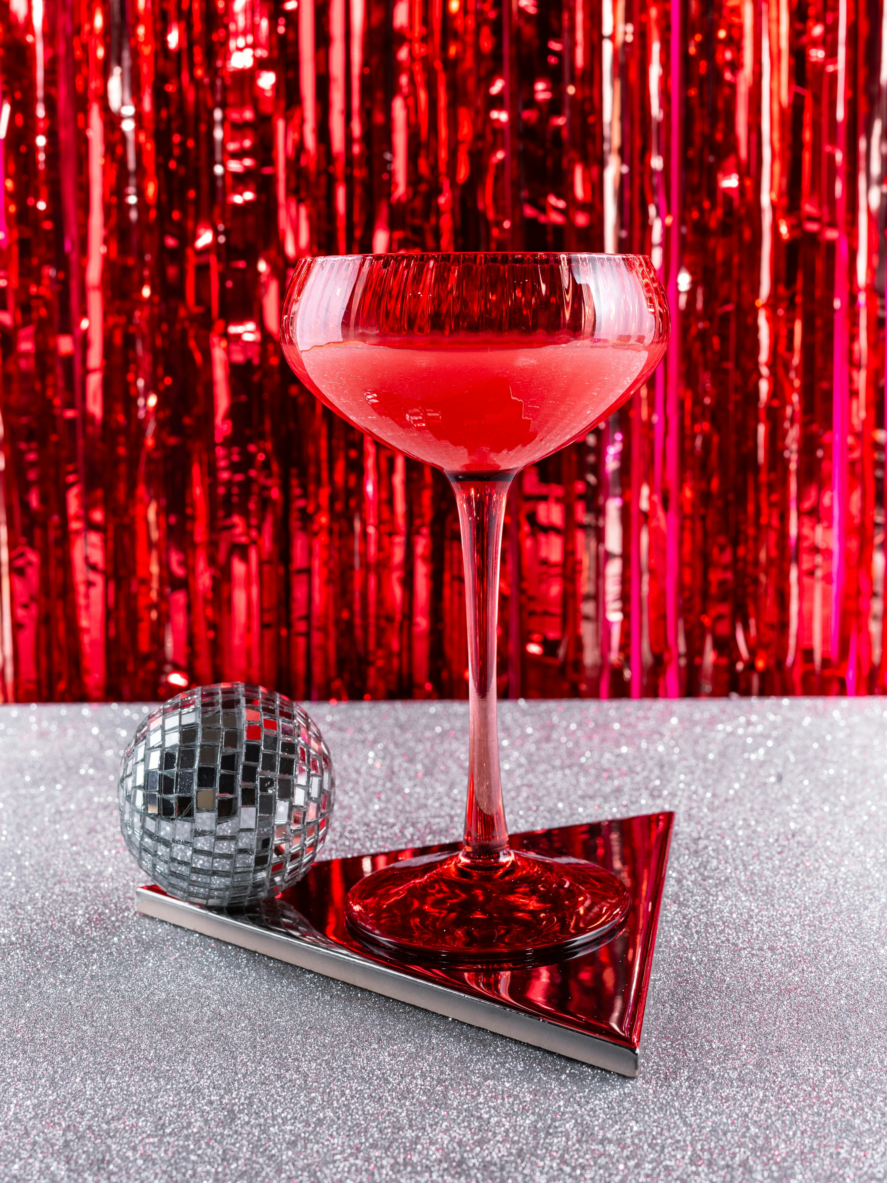 A glass of wine sitting on top of a table