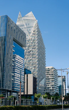 A city street with tall buildings in the background
