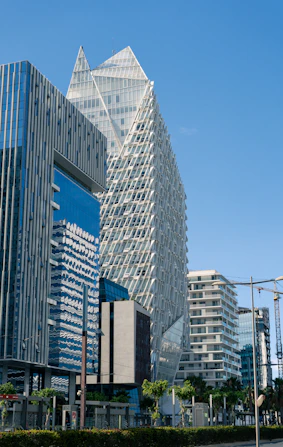 A city street with tall buildings in the background