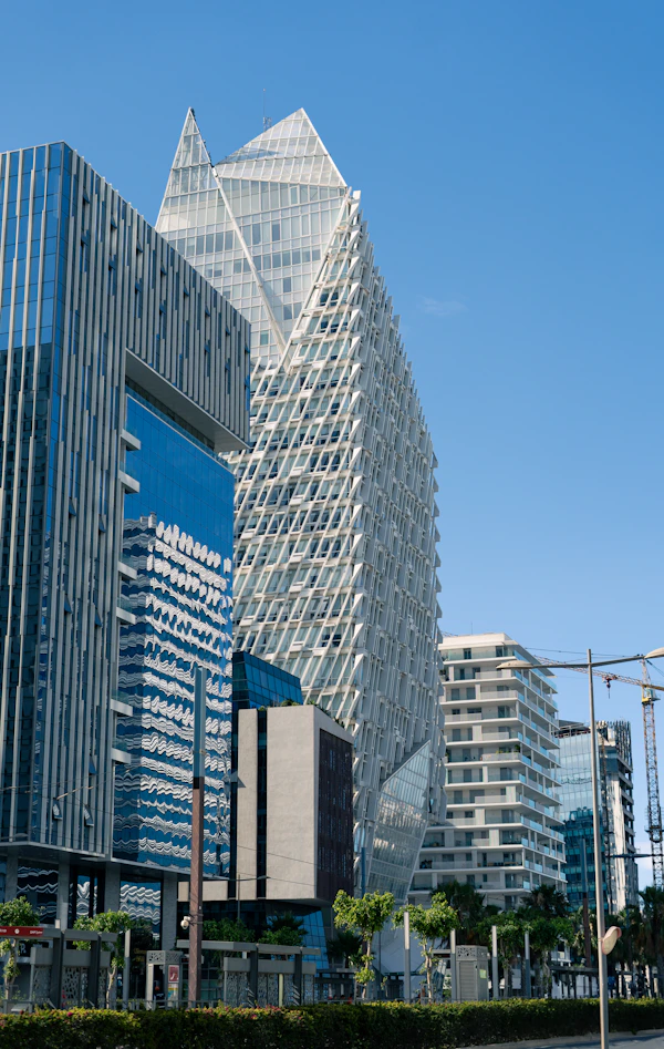 A city street with tall buildings in the background