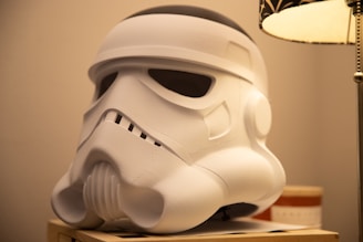 A lamp that has a storm trooper helmet on it