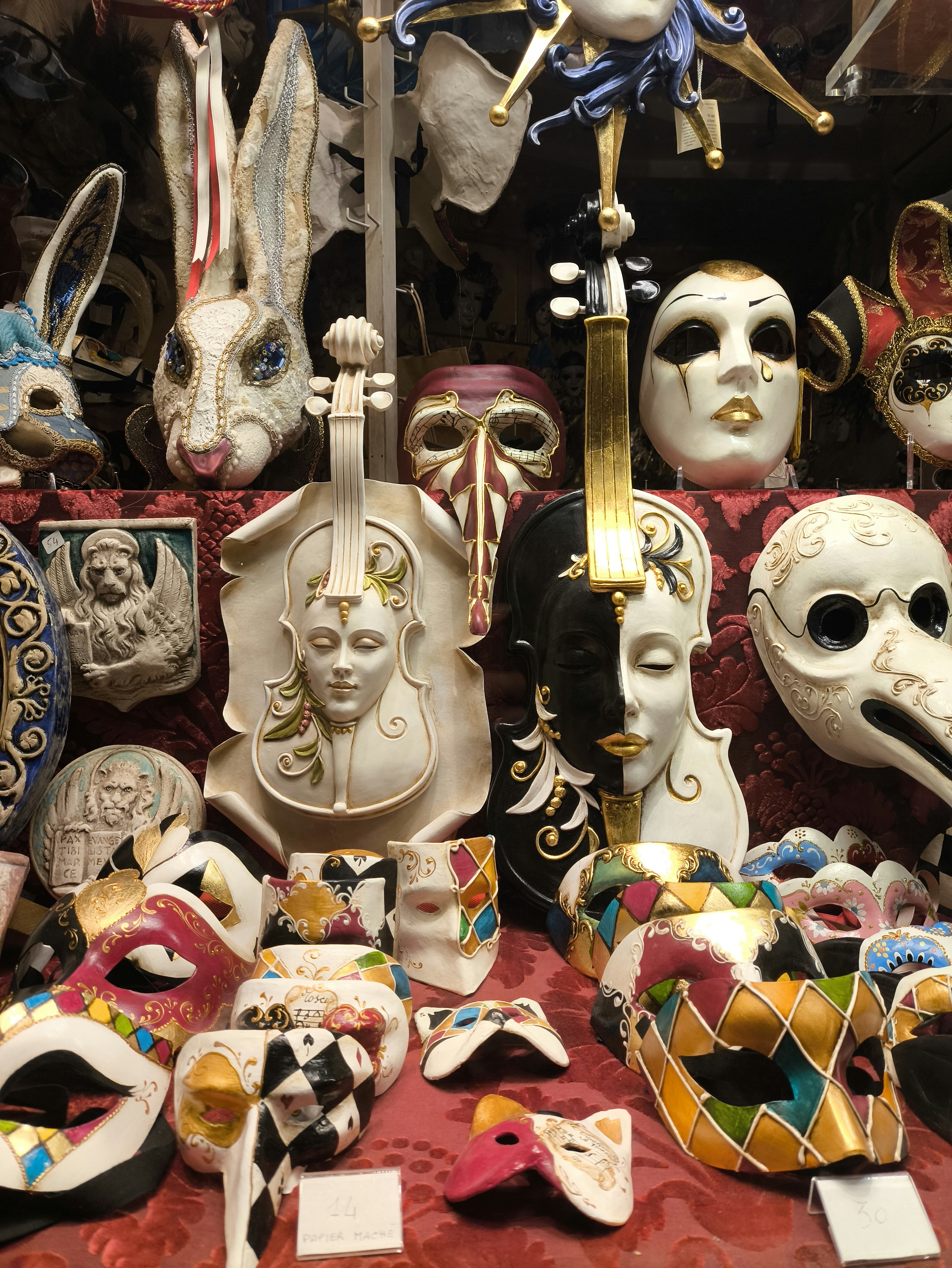 A table topped with lots of masks and masks
