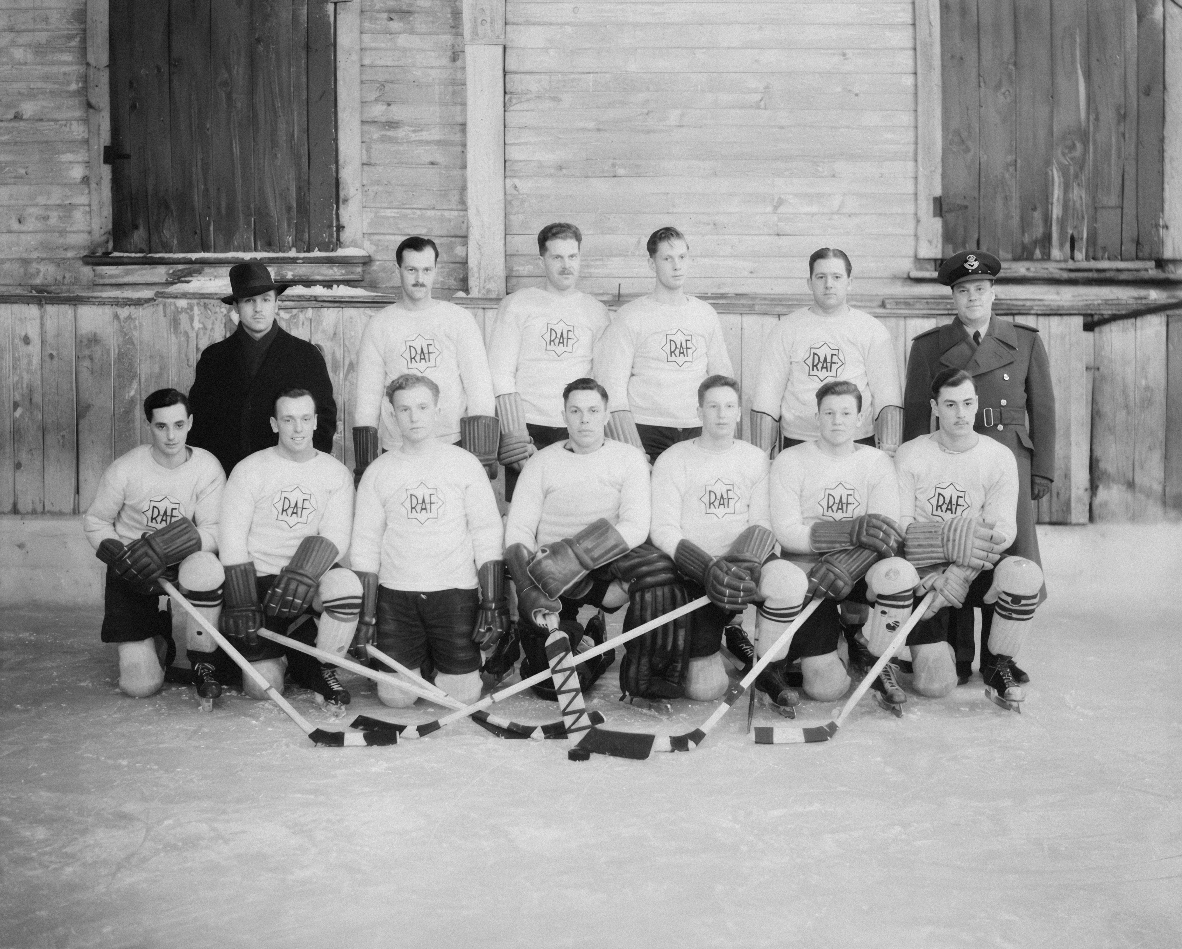 A vintage hockey team poses for a group portrait.