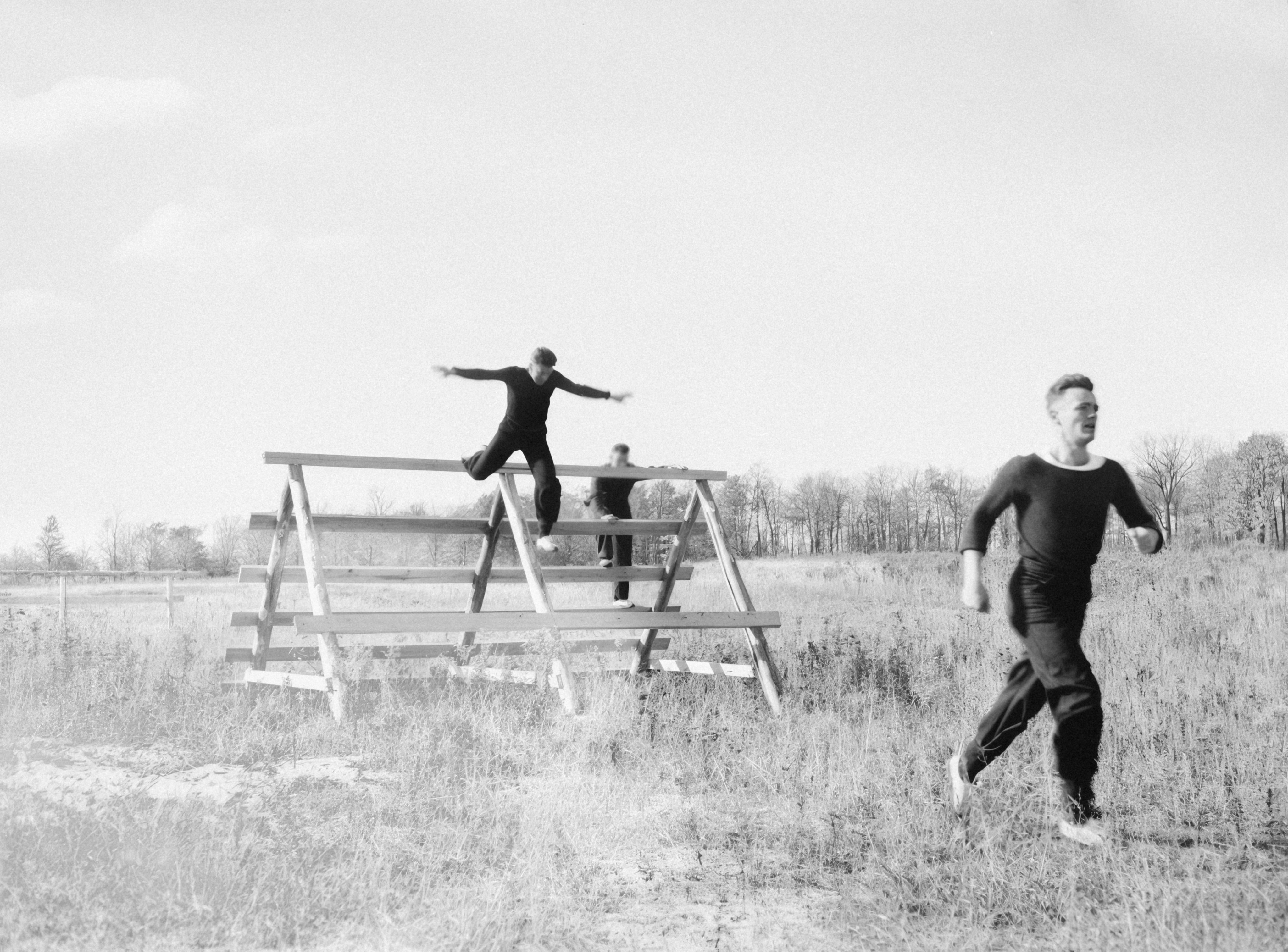 Men training on an outdoor obstacle course