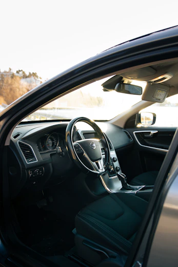 A view of the inside of a car from the driver's seat