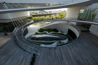 A circular building with a circular walkway in front of it