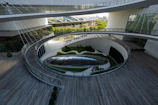 A circular building with a circular walkway in front of it