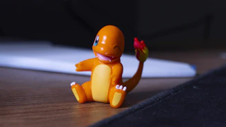 A small toy sitting on top of a wooden table