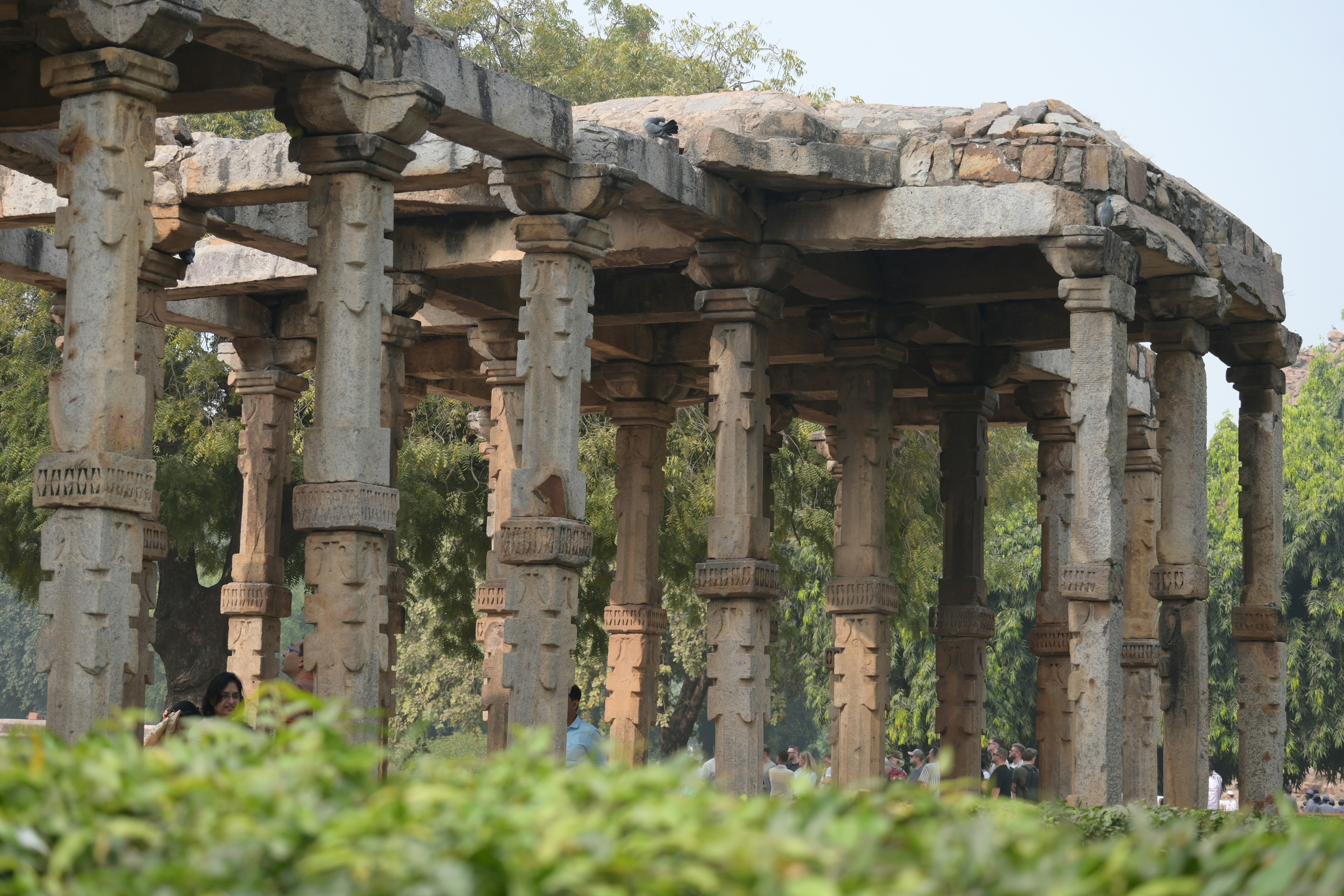 A row of stone pillars in a park