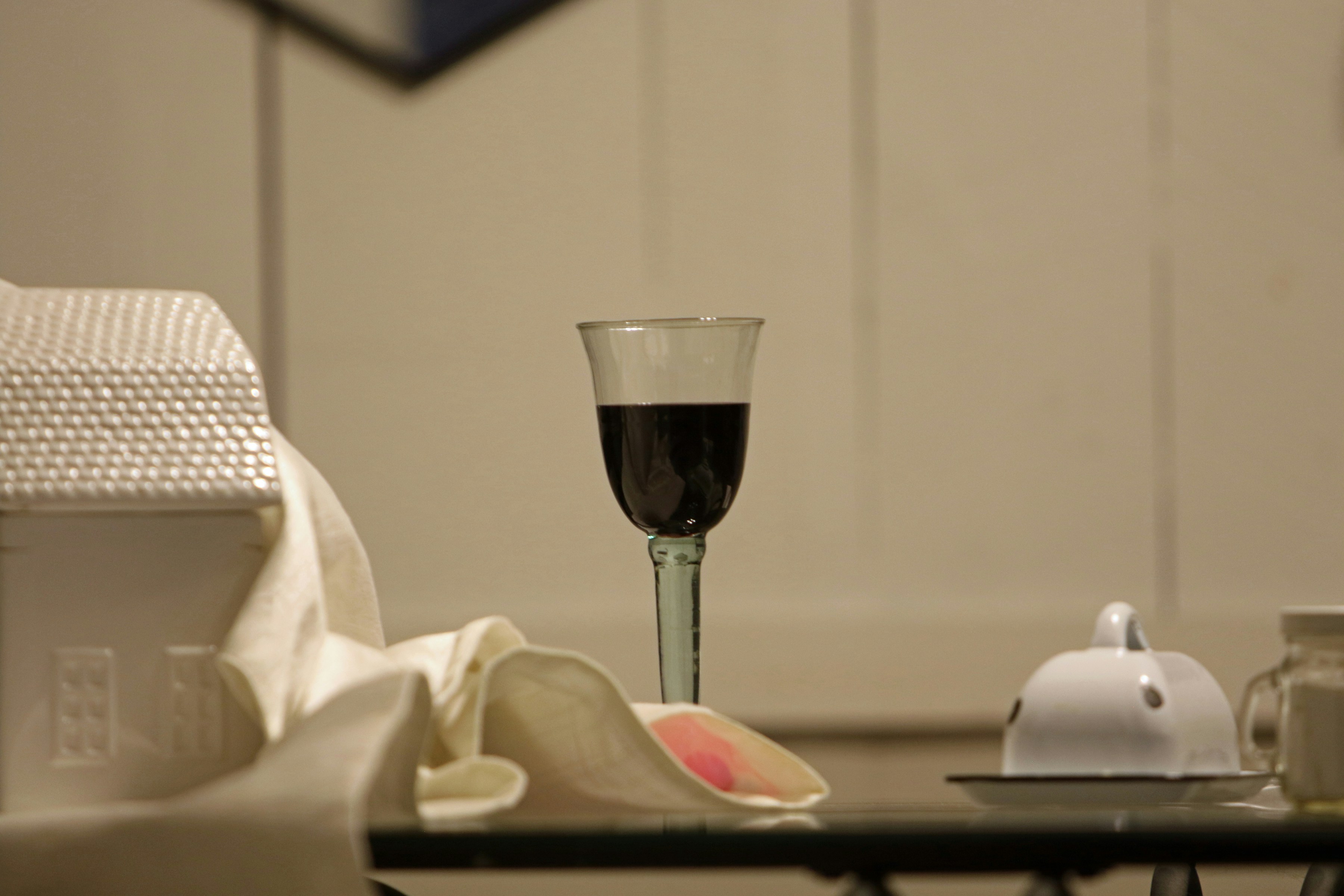 A glass of wine sitting on top of a table