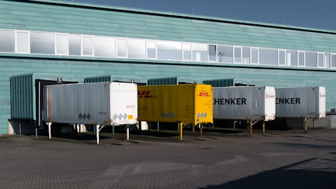 A group of trucks parked in front of a building