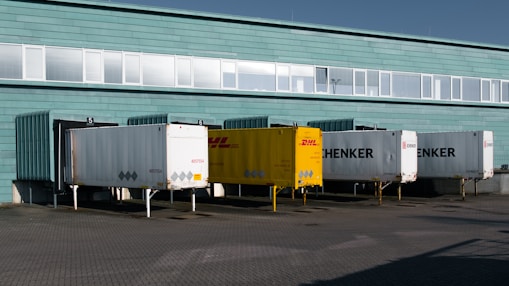 A group of trucks parked in front of a building