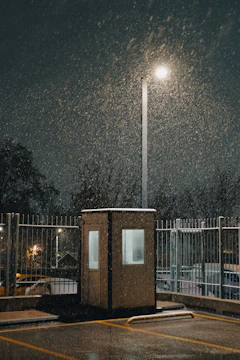 A parking lot covered in snow at night