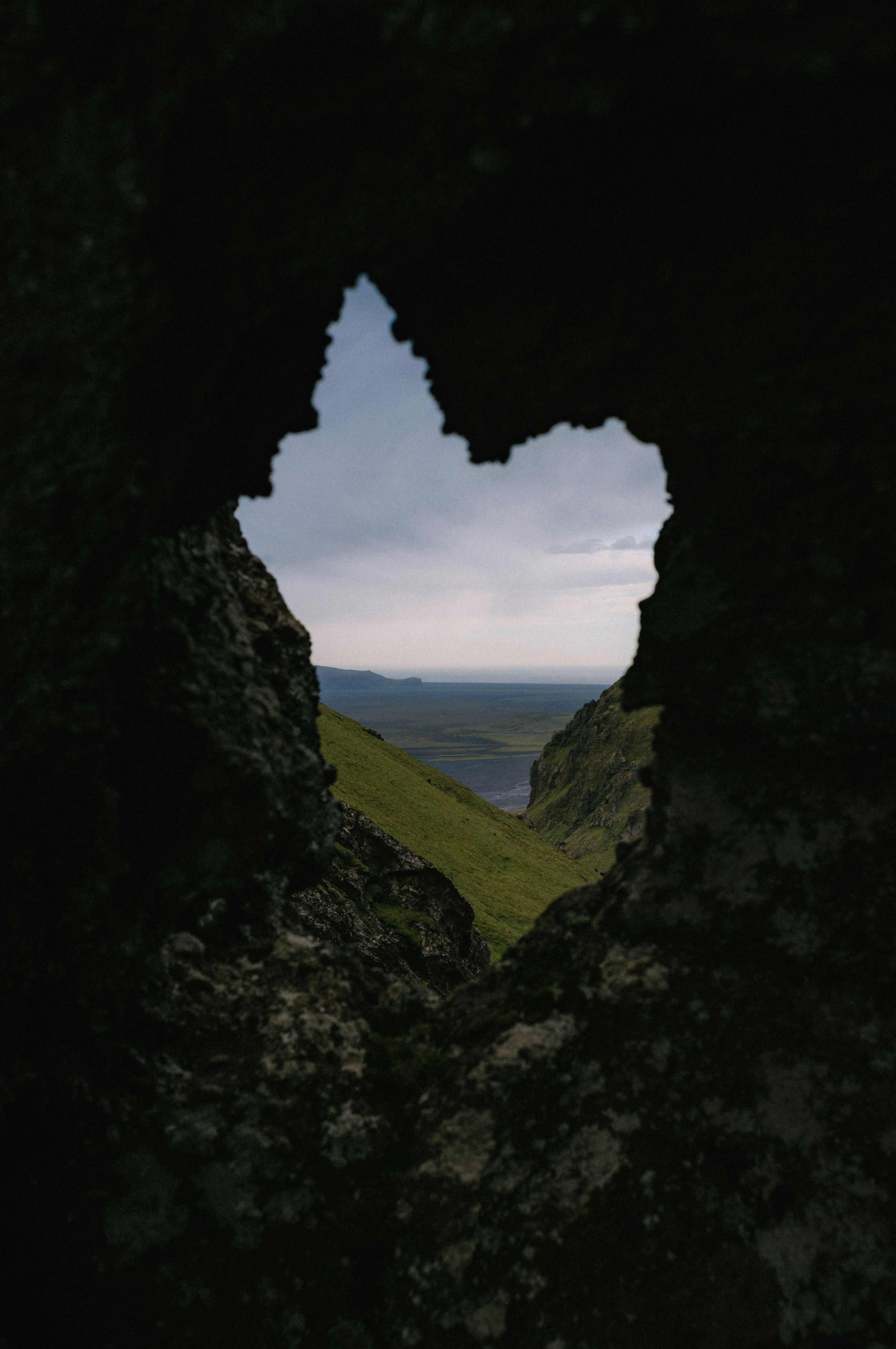 A heart shaped hole in the side of a mountain