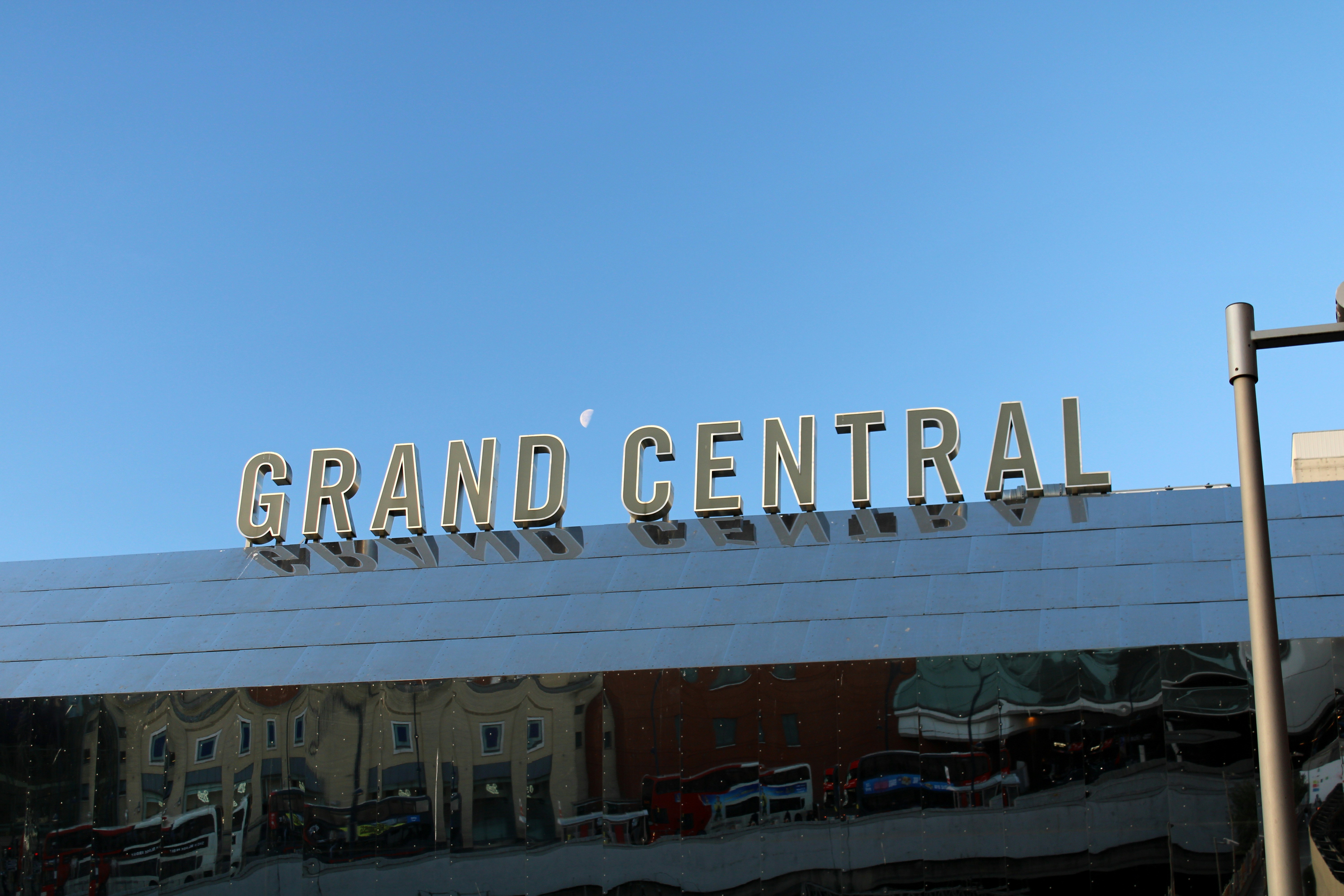 A building with a sign that reads grand central