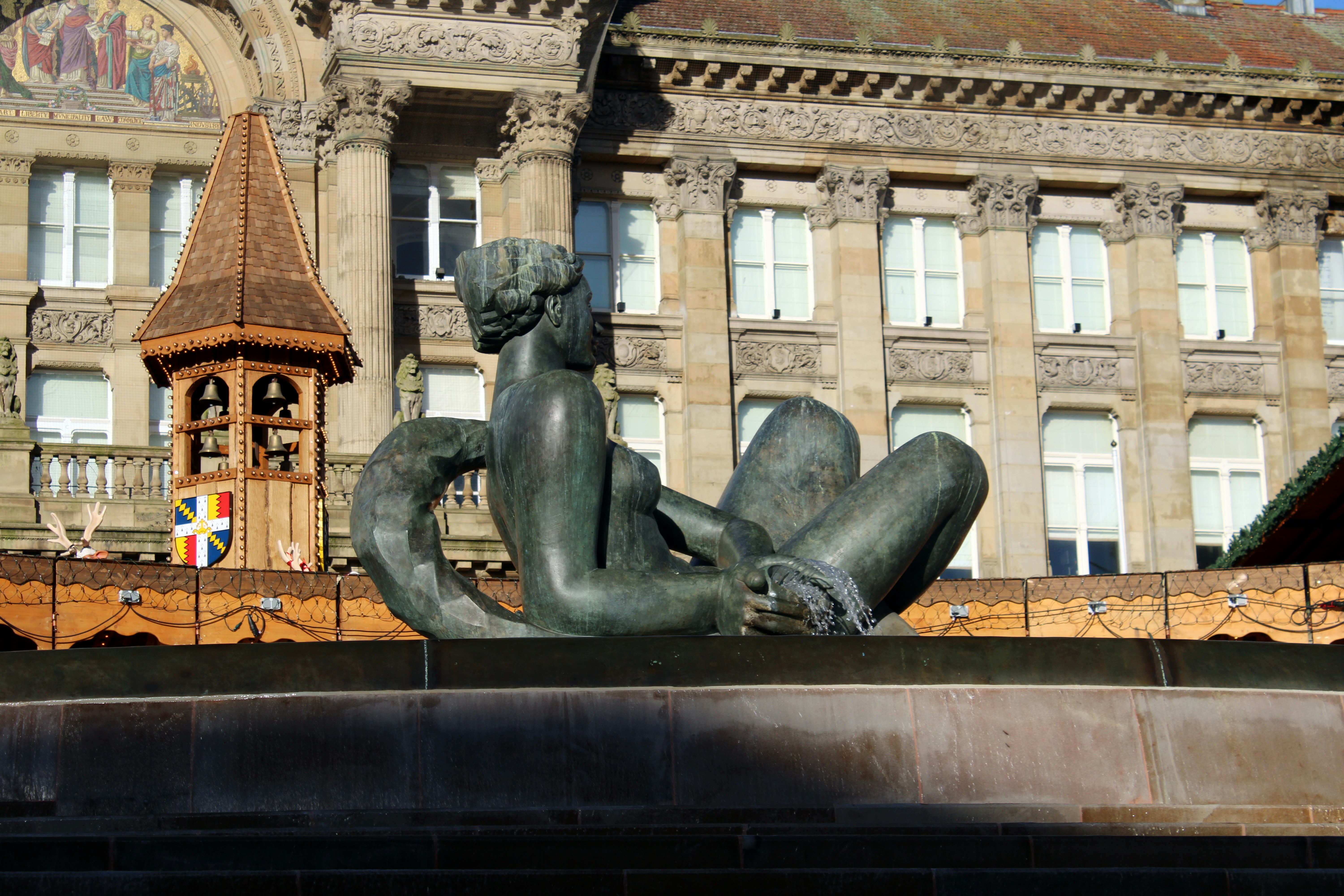 A large building with a statue in front of it