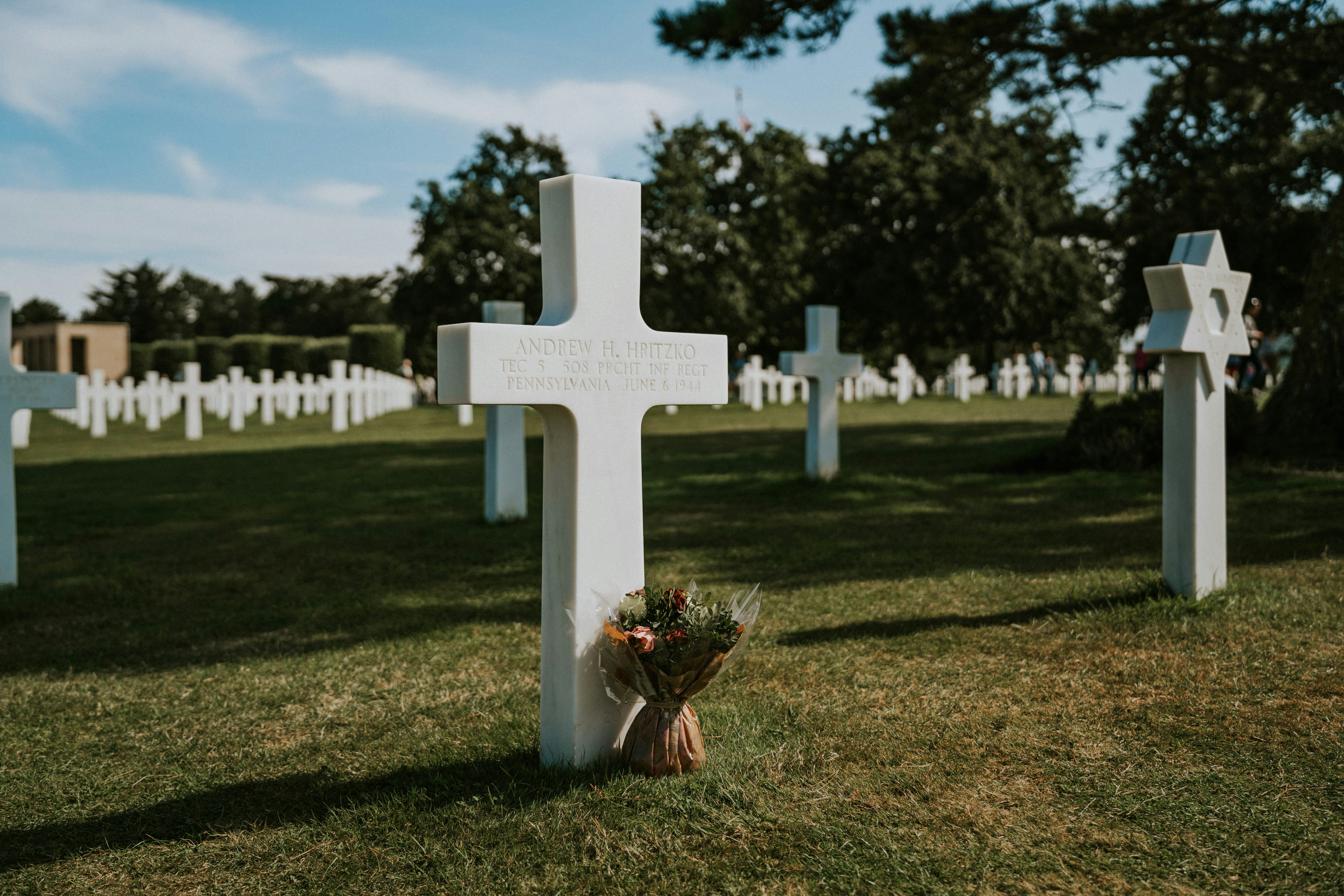 woman wearing yellow long-sleeved dress under white clouds and blue sky during daytime