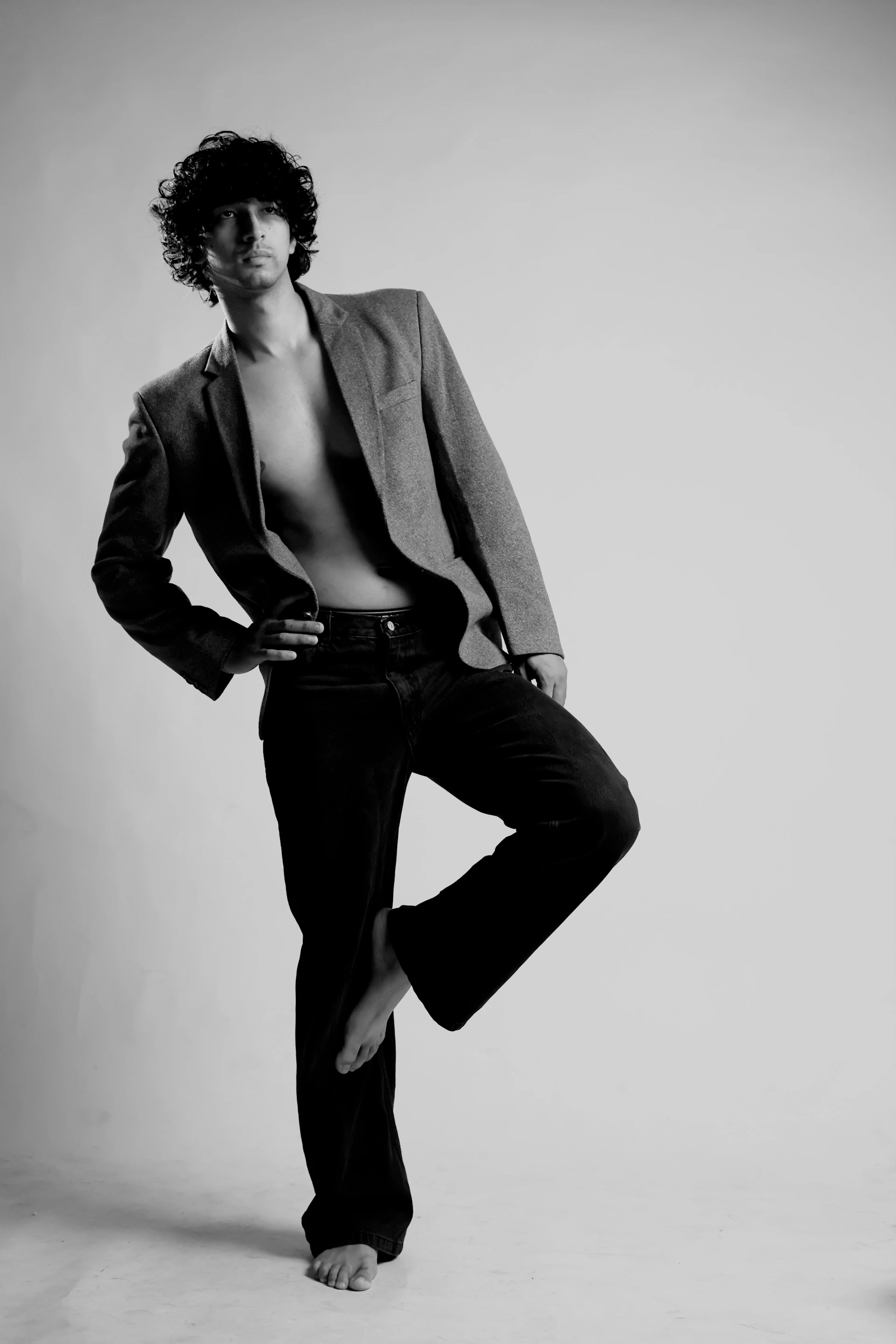 A black and white photo of a man in a suit