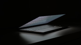 A laptop computer sitting on top of a table