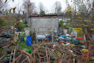 A yard full of trash and other items