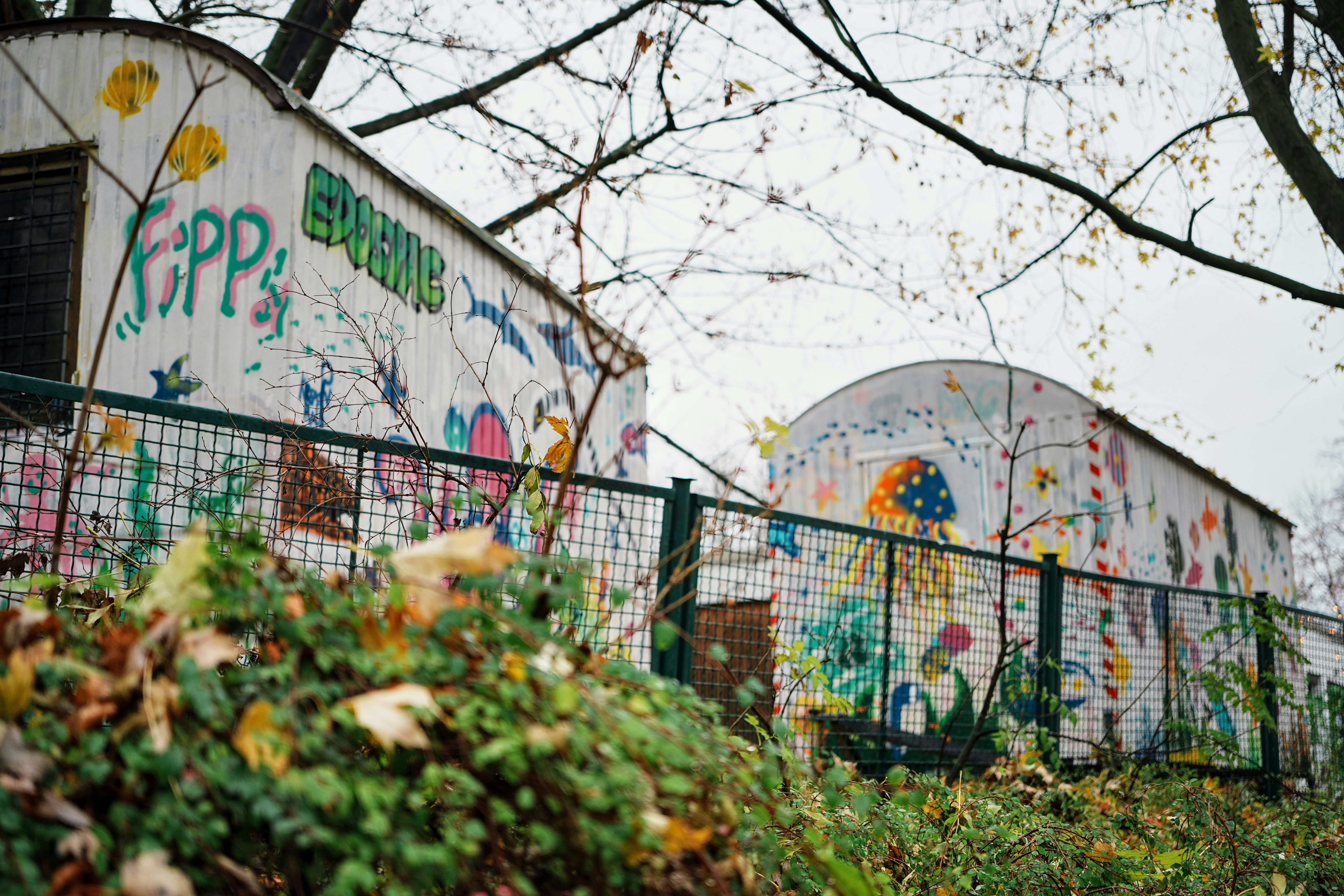 A fence that has some graffiti on it