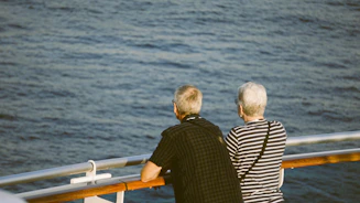 A couple of people that are on a boat
