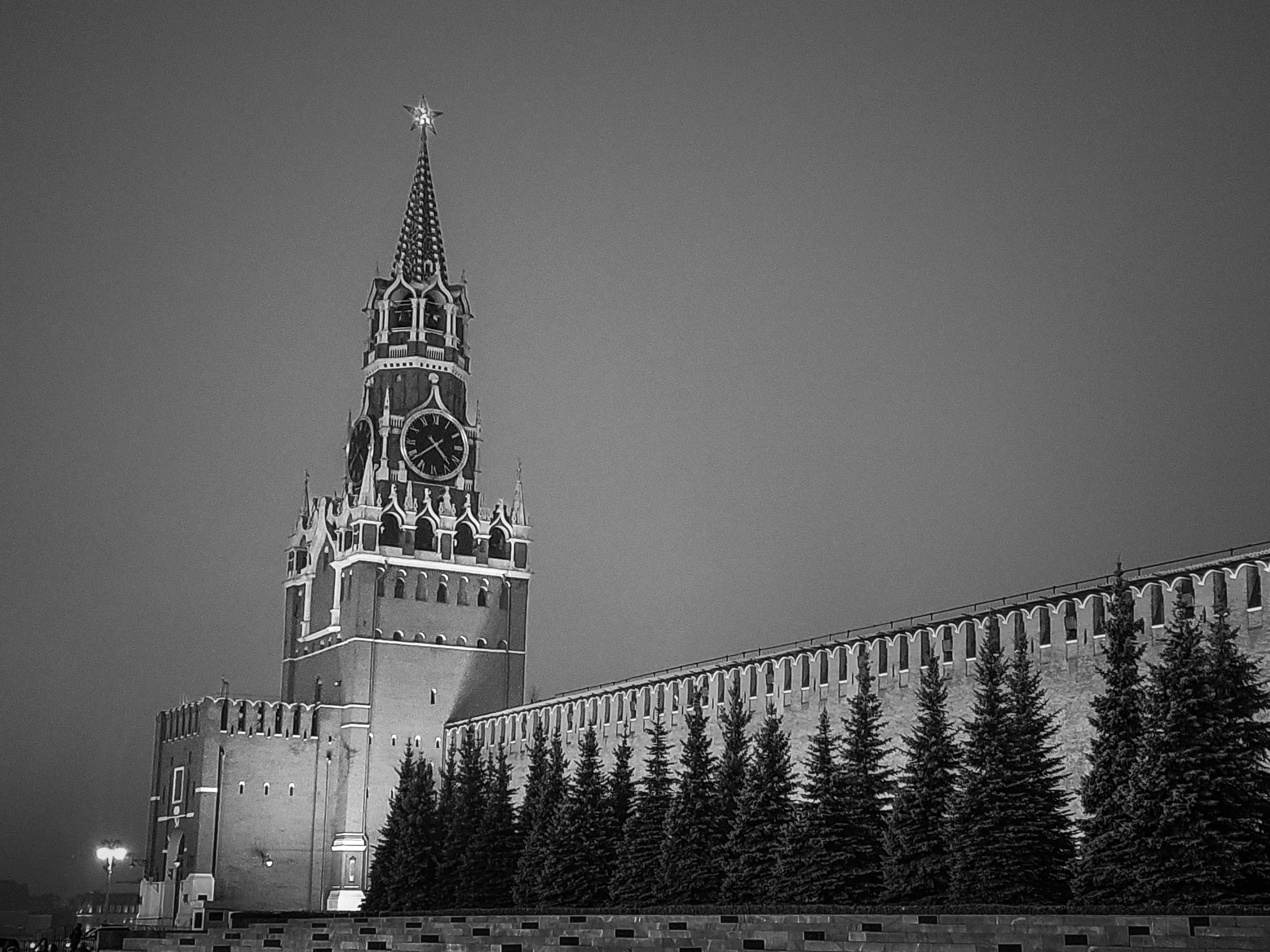 A very tall building with a clock on it's side