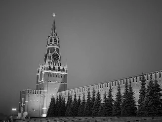 A very tall building with a clock on it's side