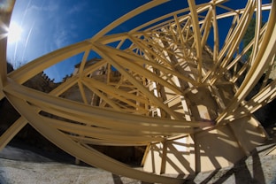 A close up of a wooden structure with a blue sky in the background