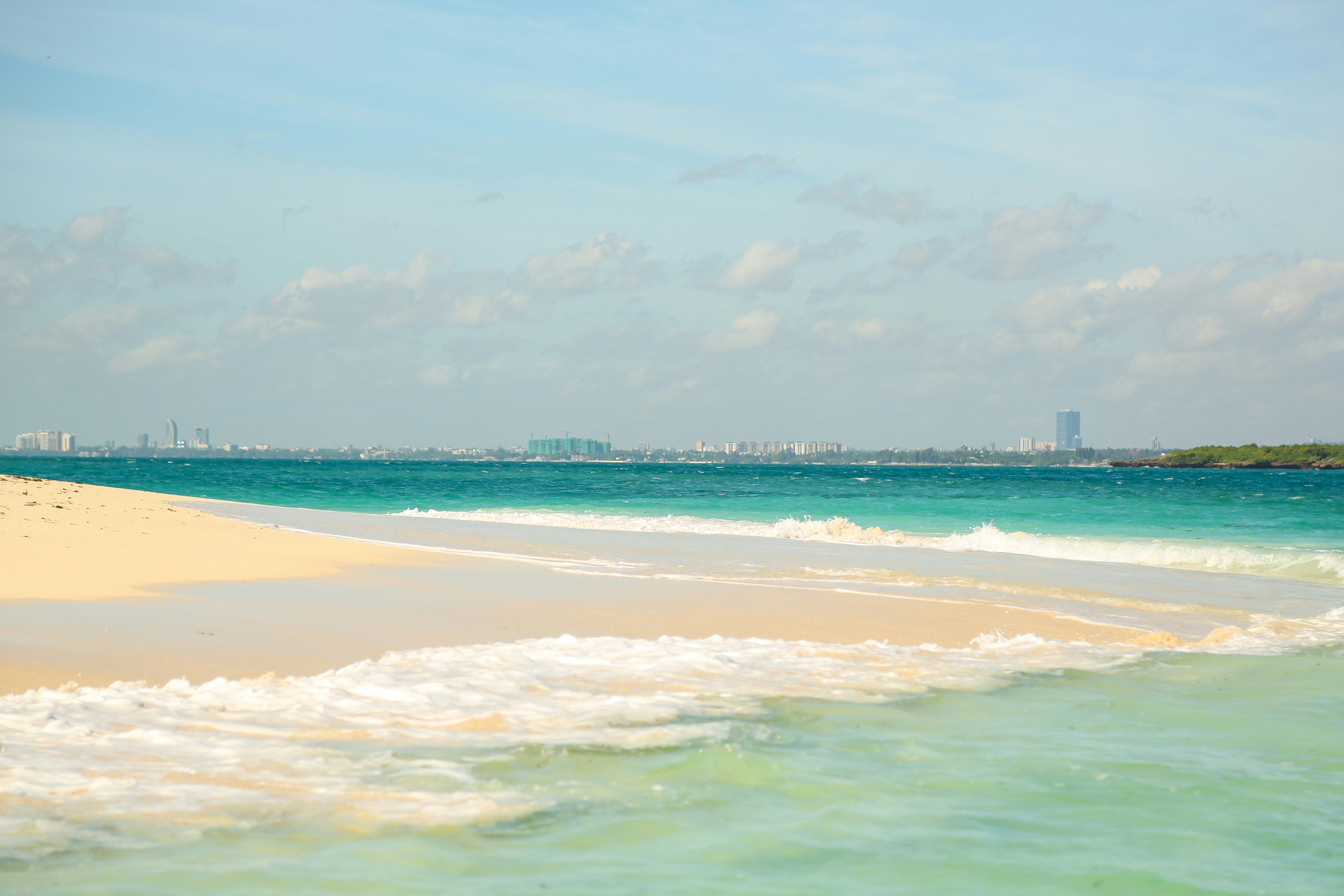 A view of a beach from the water